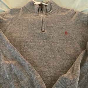 Grey polo fleece with and red polo sign.